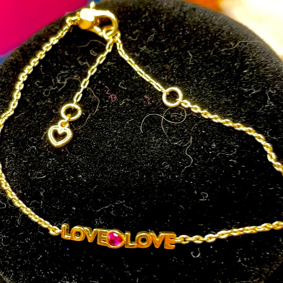 Very cute Kate Spade bracelet that says love twice with a pink stone in middle. - Picture 4 of 4